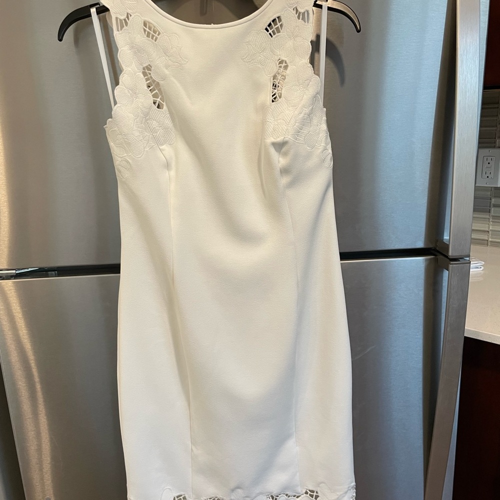 Brand new with tags! Beautiful white dress with cut out